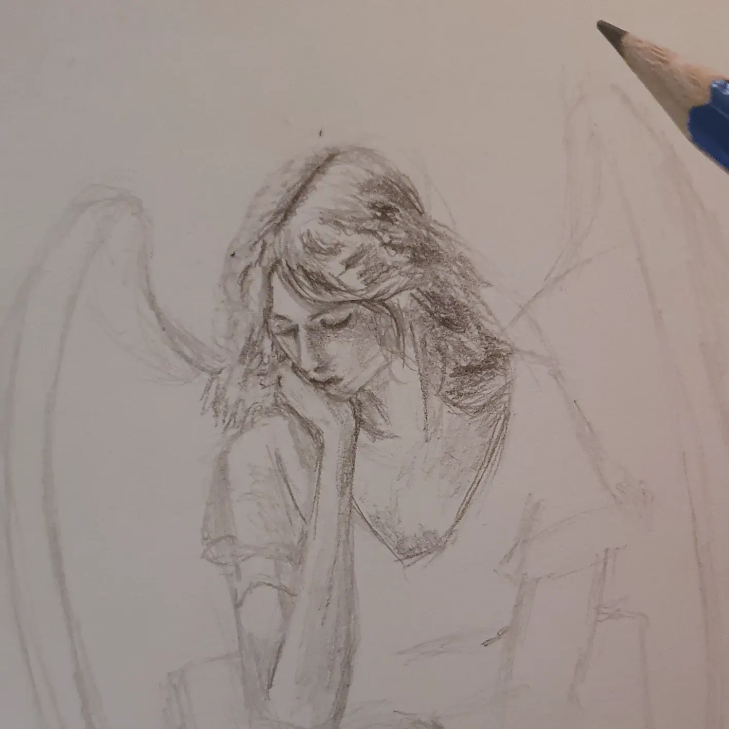 Work in progress: the angel half drawn, wings still bare outlines.