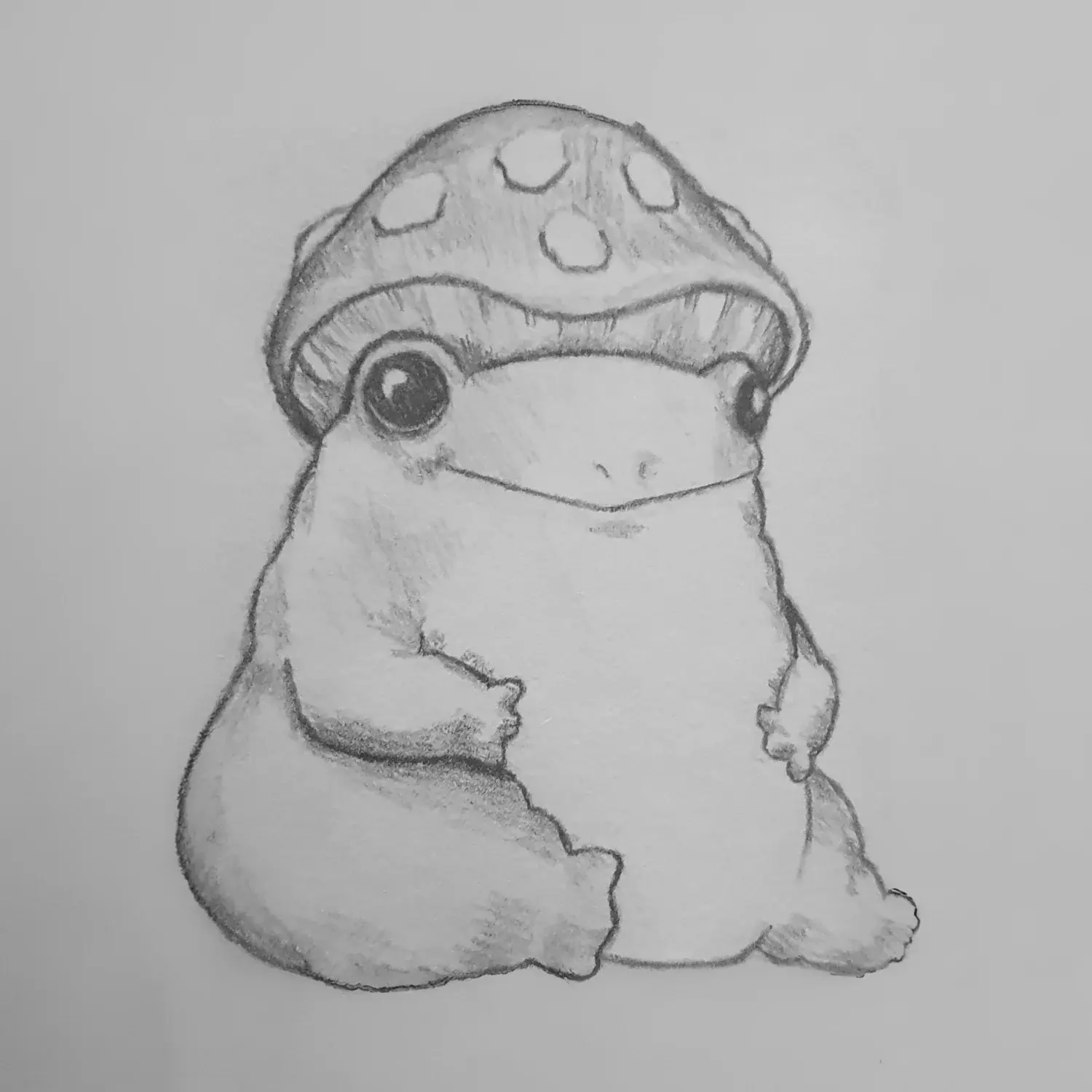 A small frog sitting under a spotted mushroom cap.