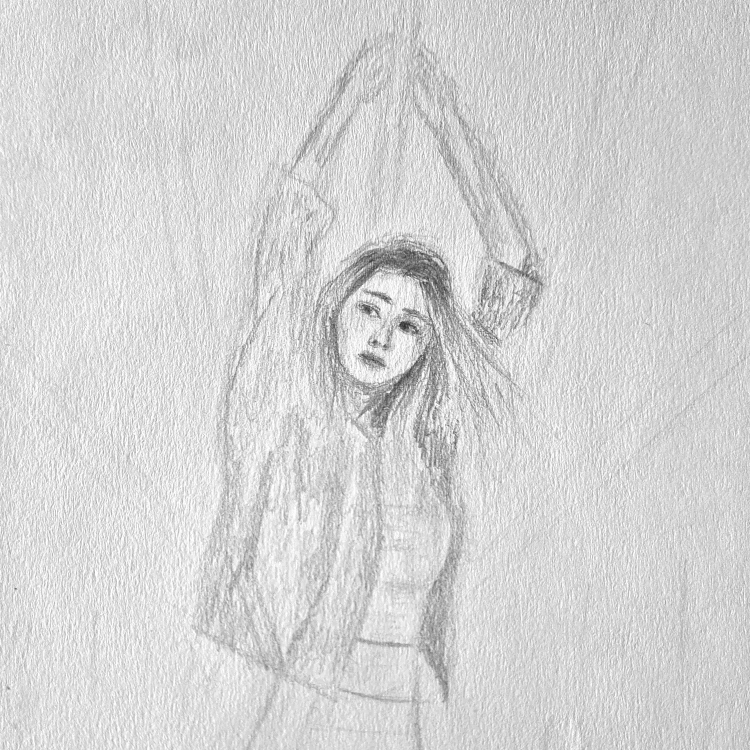 A woman holding the overhead rail on a moving train, hair drifting.